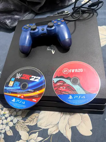 Sony PS4 PRO with DualShock Controller + FIFA 20  WWE 2K22 Discs