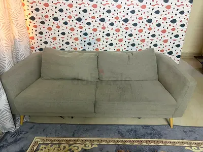 Light grey 2-seater sofa in good used condition