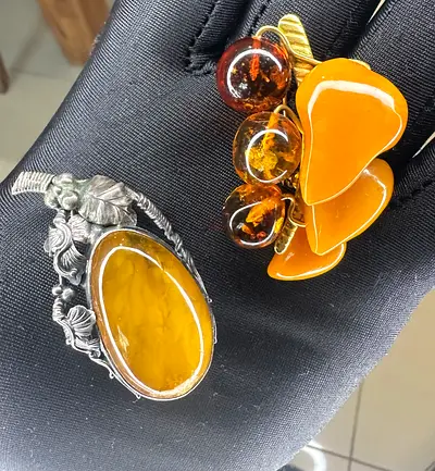 Two brooches with Amber and silver