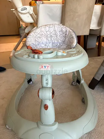 Light green baby walker/exerciser with seat - gently used