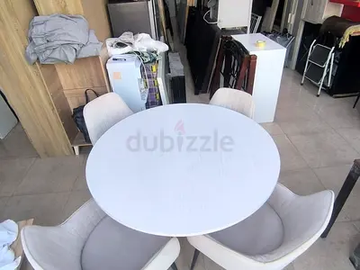 White Round Dining Table with 4 Upholstered Chairs
