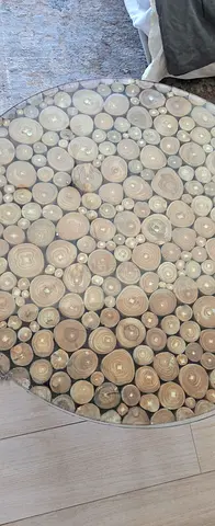 Round wooden coffee table  with covered temper class   Diameter around 80 cm