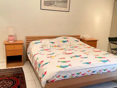 Single wooden bed frame with mattress and bedside table - good condition