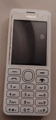 White Nokia feature phone - working keypad, urgent for sell. Pick your price and take them.