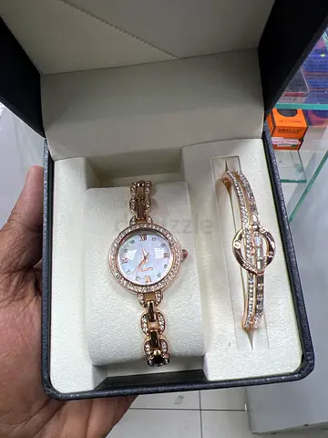 Rose gold womens watch and matching bracelet set - like new