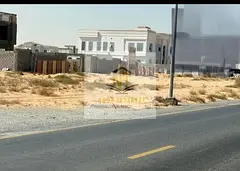 Residential land for sale in Al Hawshi, Sharjah, with a down payment of AED 130,000. The plot is 2,7