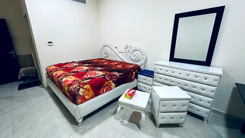 White tufted queen bed with matching dresser and nightstand - good condition
