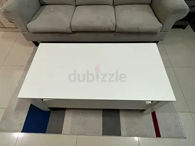 White modern coffee table with lower shelf - good condition