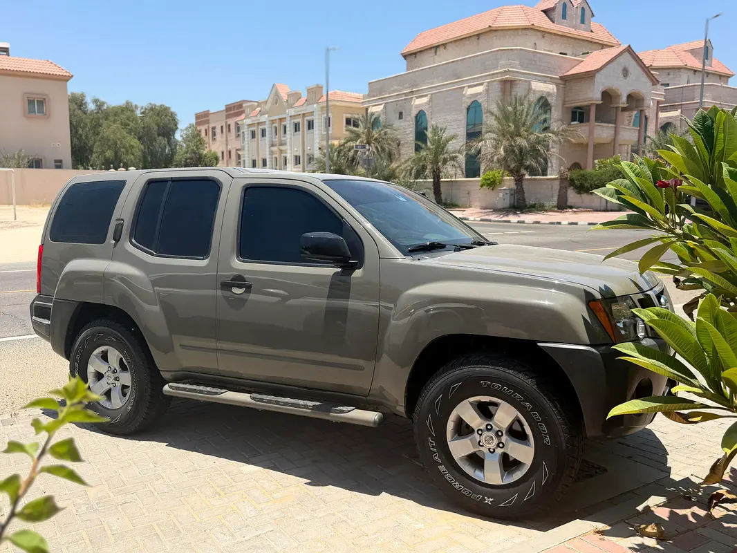 Nissan Xterra 2013 — photo 1 of 14