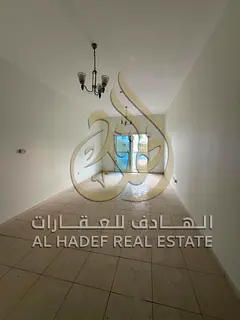 Two-bedroom apartment with a living room in Al Majaz 3 area. The apartment features a separate livin
