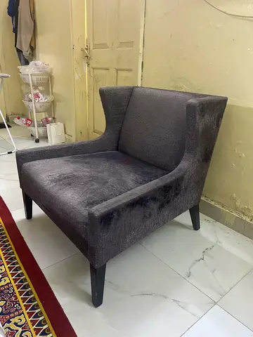 Dark grey single-seater lounge chair - good condition