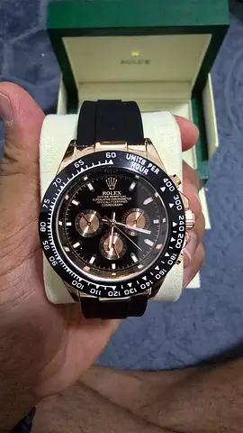 Rolex style chronograph watch with black dial and rubber strap (used)