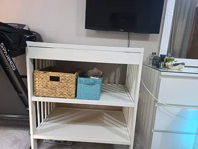 IKEA White wooden baby changing table with storage shelves