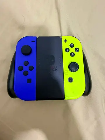 Pair of Nintendo Switch Joy-Con Controllers (Neon Yellow  Blue) with Premium Grip - Used