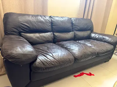3+2 faux leather sofa from home centre , fairly used and damaged Abu Dhabi Shahbiya 12