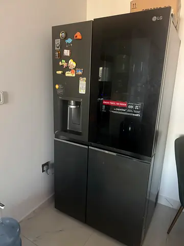 LG Black Side-by-Side Refrigerator with Water Dispenser - Good Condition
