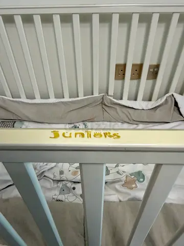 White wooden baby crib with mattress and bedding - good condition
