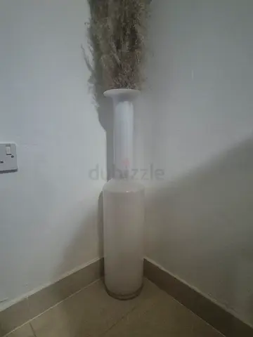 Tall white glass vase