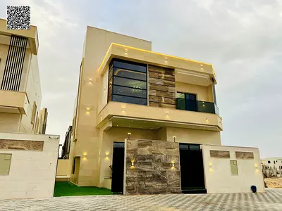 Luxury 3-story villa for sale in the best areas of Ajman, including registration and ownership fees, with high-end finishing and a strategic location
