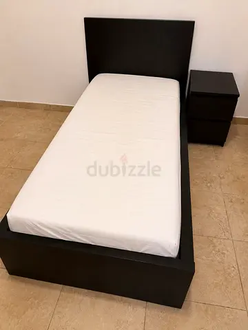 Single bed frame with headboard and matching bedside table - dark wood finish