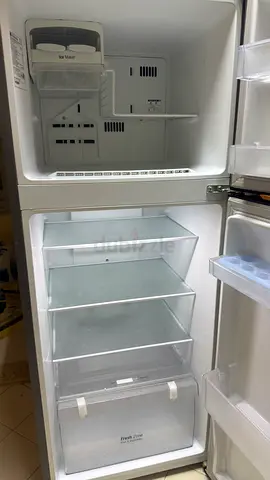 Used two-door refrigerator with freezer - clean and working