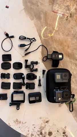 GoPro Hero 5 action cam with 2 batteries and accessories + case (used) and hero+ action cam