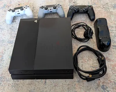 PlayStation 4 with 3 DualShock Controllers + Charging Dock and Cables - Good Working Condition