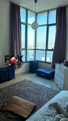 For sale in Ajman Creek Towers, Al Rashidiya, full sea view, 3 bathrooms, laundry room, great value