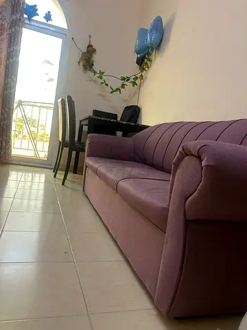 3-seater purple fabric sofa in good condition