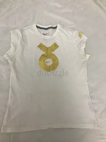 White womens T-shirt with gold XO logo, size M