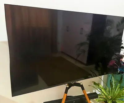 65-inch LED Smart TV - Good working condition. Includes tripod stand for TV and the JVC soundbar.