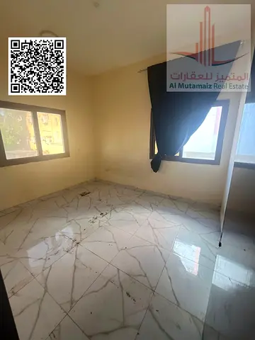 A comfortable one-bedroom apartment available for annual rent in Al Najma Building, located in the sought-after Al Bustan area of Ajman. The apartmen