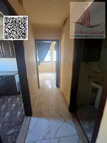 A comfortable one-bedroom apartment available for annual rent in Al Najma Building, located in the sought-after Al Bustan area of Ajman. The apartmen