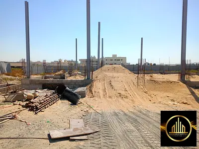 A plot of land on the main street. Al-Jarf Industrial Area 2.