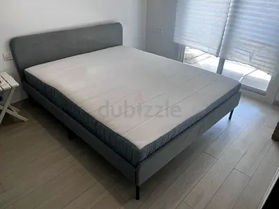 IKEA Bed set. Upholstered Bed Frame with Mattress and rest