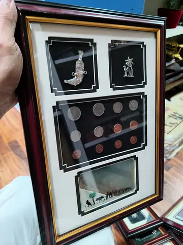 Framed Middle Eastern Collectible Display with Coins and Miniatures and seven sands - 40*28cm