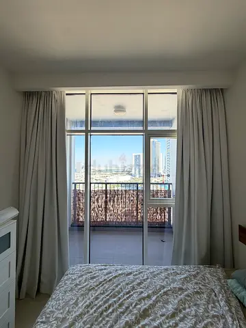 Light-blocking full-length bedroom curtains — neutral beige. good condition