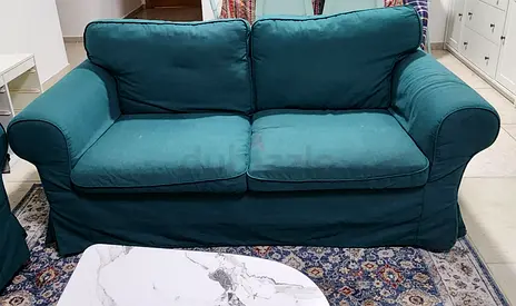 Urgent Sale Two-seater teal fabric sofa with removable slipcover