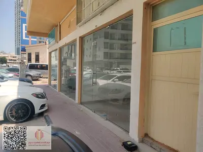 Here is the English translation in a professional property listing format: **Two Commercial Shops for Annual Rent – Al Rawda 2, Ajman** An excellent