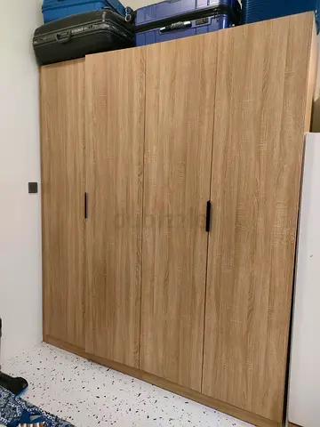 Four-door oak finish wardrobe - good condition