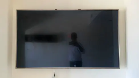 55-inch LG LED TV mounted on wall - good condition