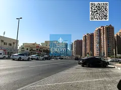 Urgent Sale: Premium Corner Commercial Building on Main – Al Nuaimia 1, Ajman