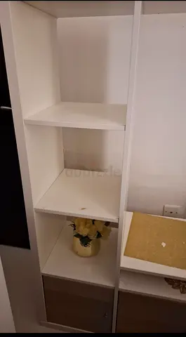 White tall shelving unit with 4 open shelves and lower cabinet - gently used