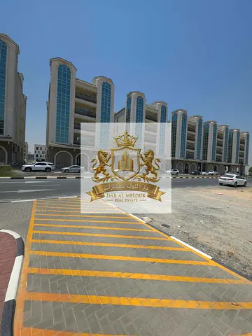 Best Price of a freehold commercial plot of land in Tilal City, Sharjah, on a main street next to Victoria School