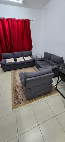Grey fabric 3+2+1-seater sofa set with ottoman and matching armchair