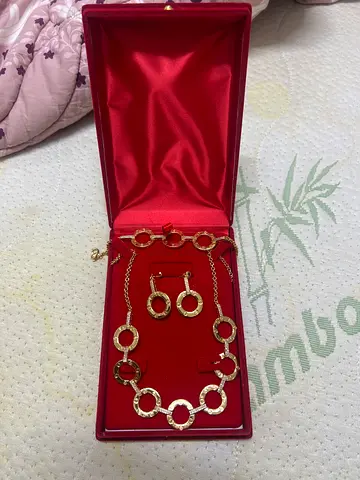 Gold-tone circular link necklace with matching earrings set