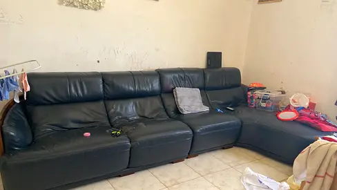 Used black leather 4-seater sectional sofa with chaise