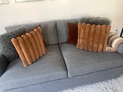Comfortable 2-seater grey fabric sofa in perfect condition