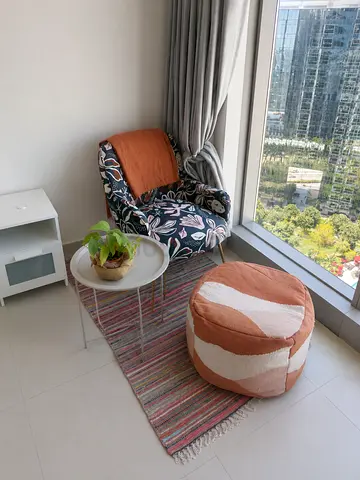 Cozy reading corner set — armchair, pouf, small rug and side table