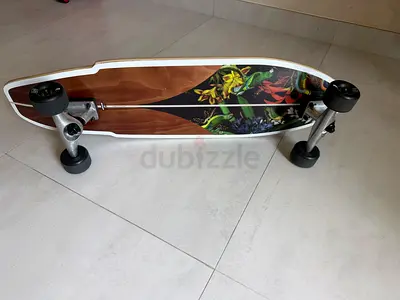 Surf skate with floral deck - used only once, good condition. Purchased two months ago for AED 899